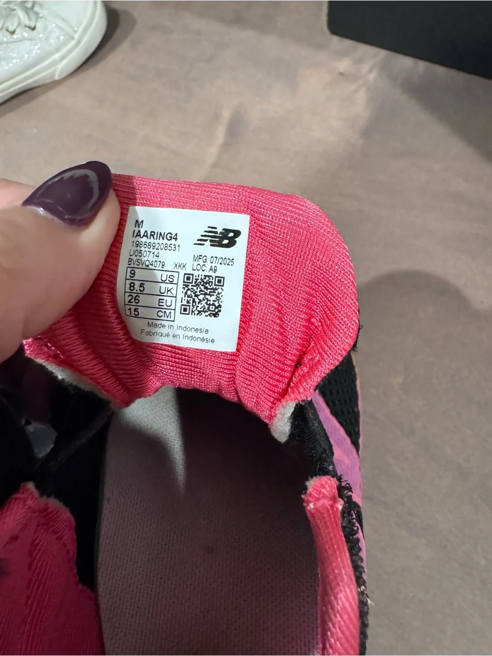 New Balance Black Sneakers with Pink and Orange Accents